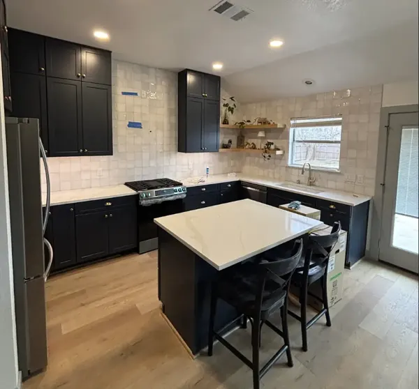 Kitchen remodel with dark cabinets and white island, Pflugerville and Austin area
