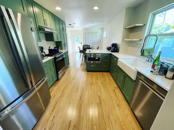 Kitchen remodel with green cabinets and farmhouse sink, Pflugerville and Austin area